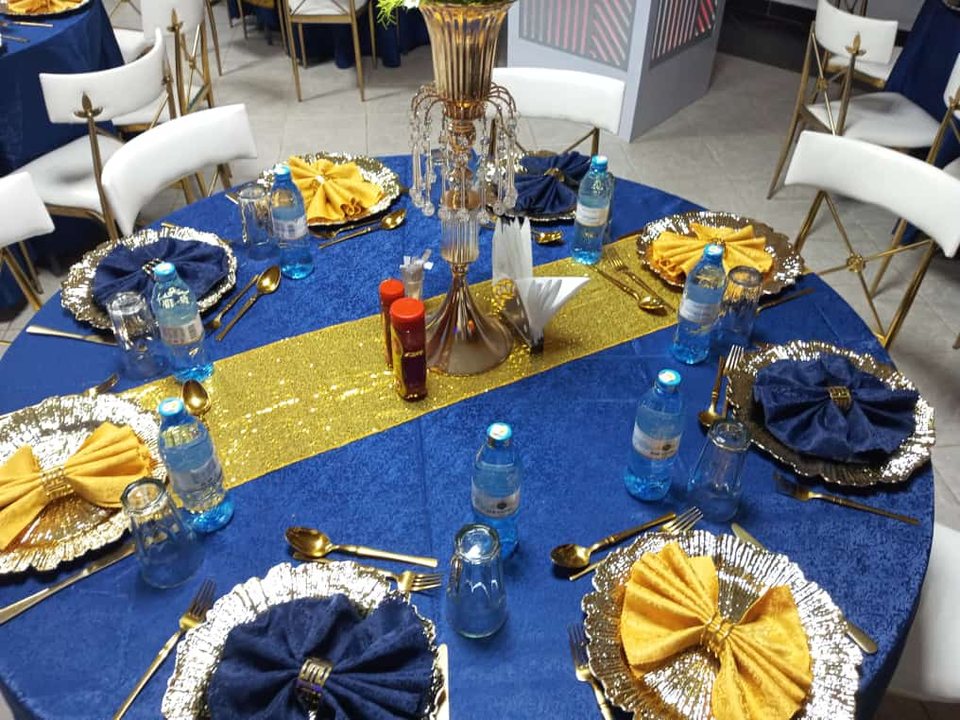 A round table set in royal blue and gold