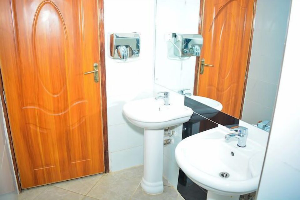 A private bathroom with basin and mirror