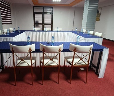 A boardroom table dressed in blue