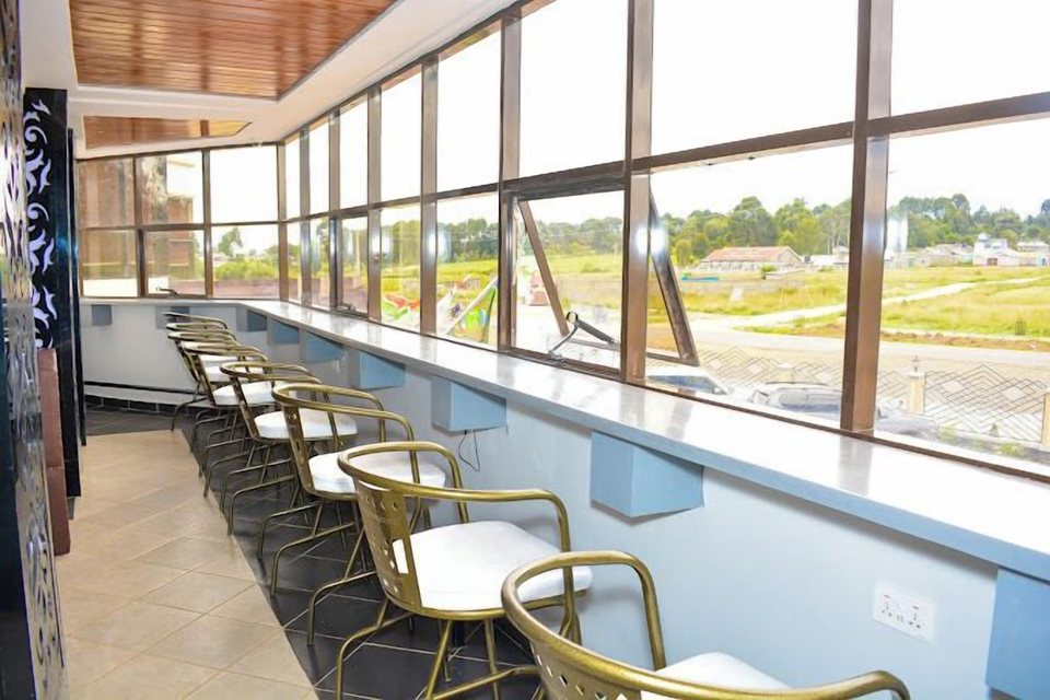 The café counter with stools along the window