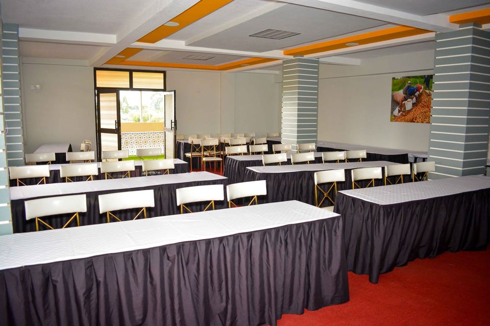 A boardroom set with dressed tables