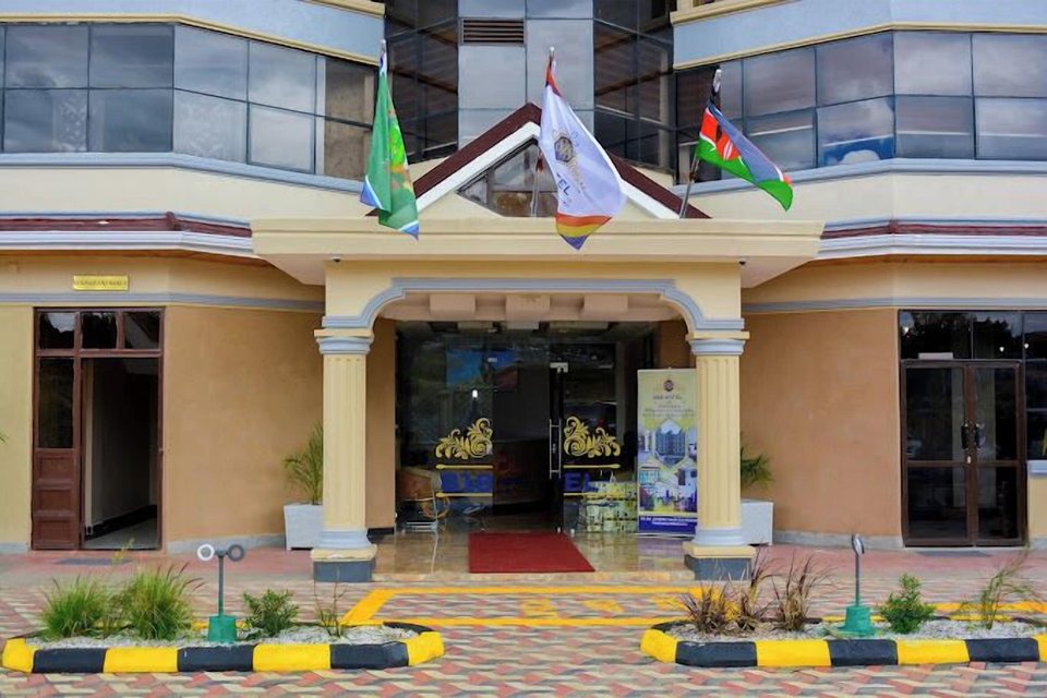 The hotel entrance with flags and a red carpet