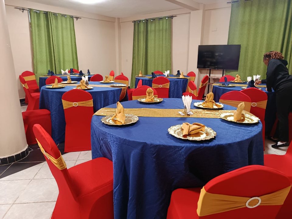 Round tables set for a celebration in the function room