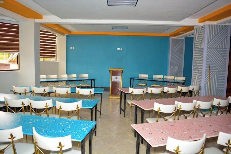 A meeting room with a blue feature wall