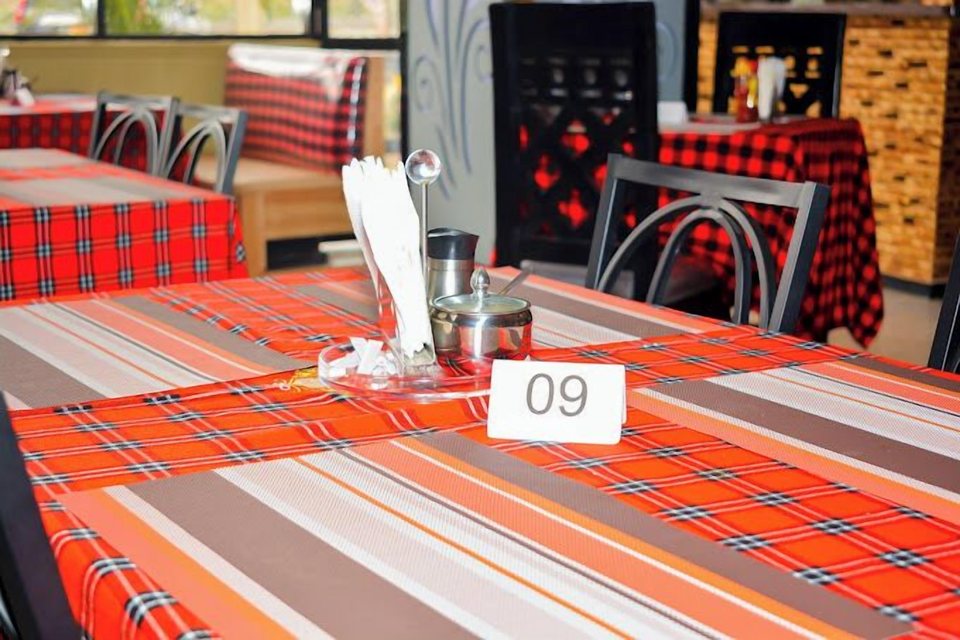 A table laid with cutlery and a flask