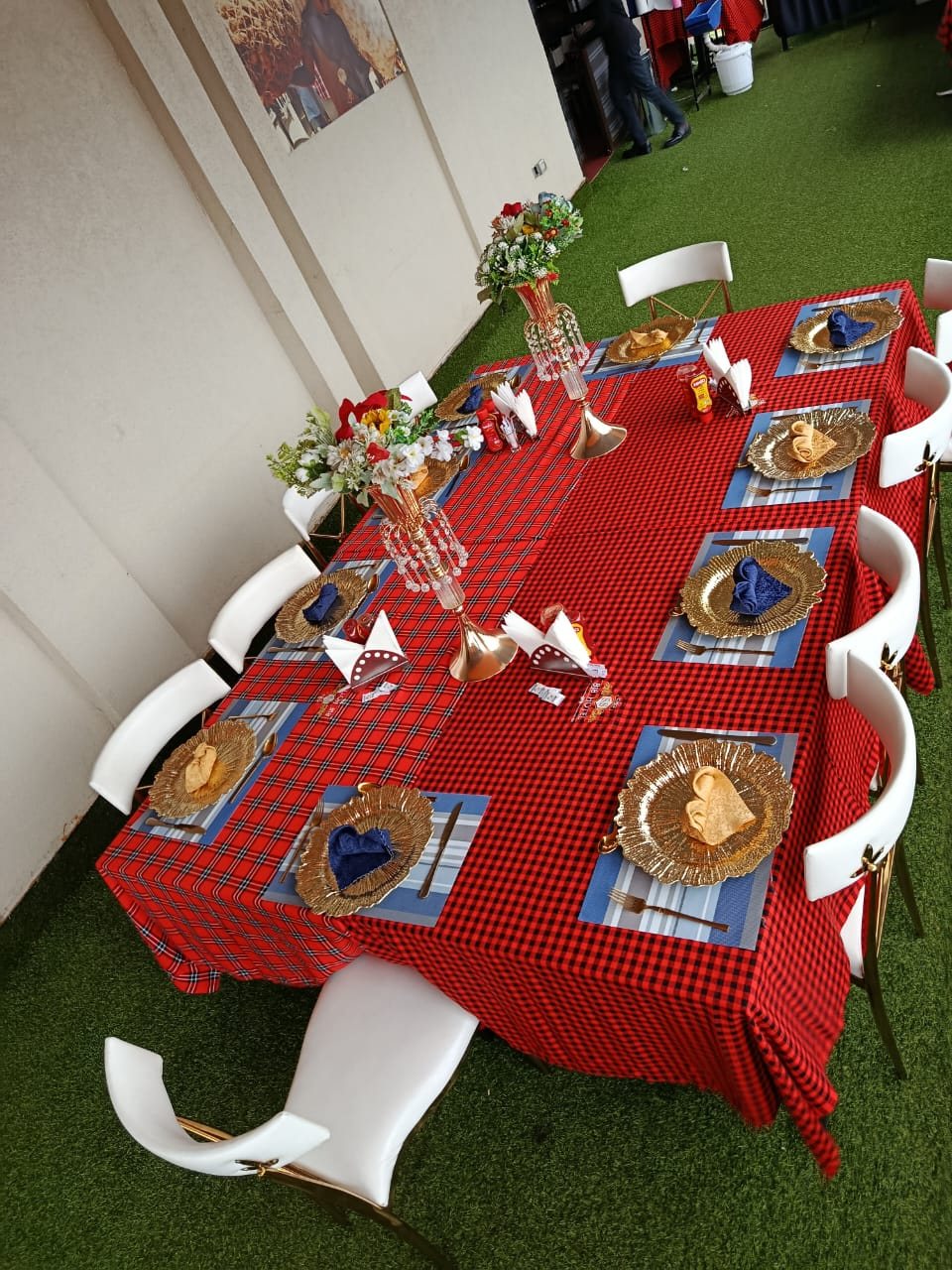 A long table on the Green Carpet Terrace set for guests